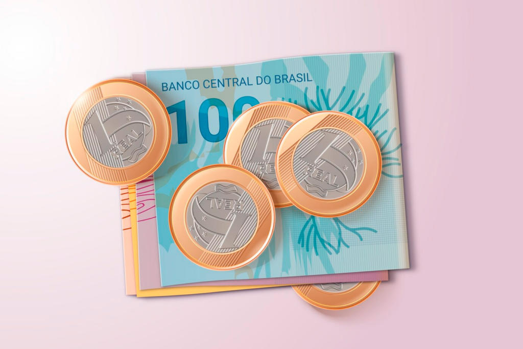 Notas de reais com algumas moedas de Real